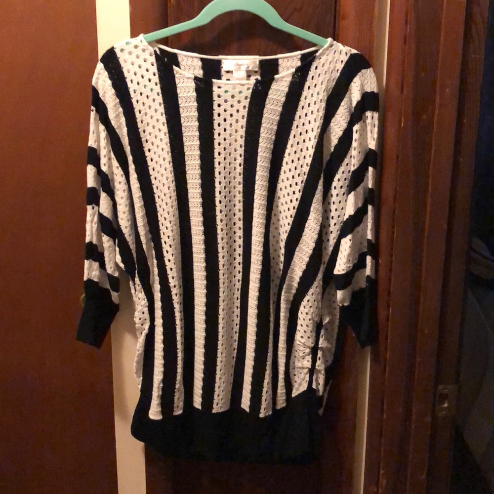 Black and white striped sweater with open area